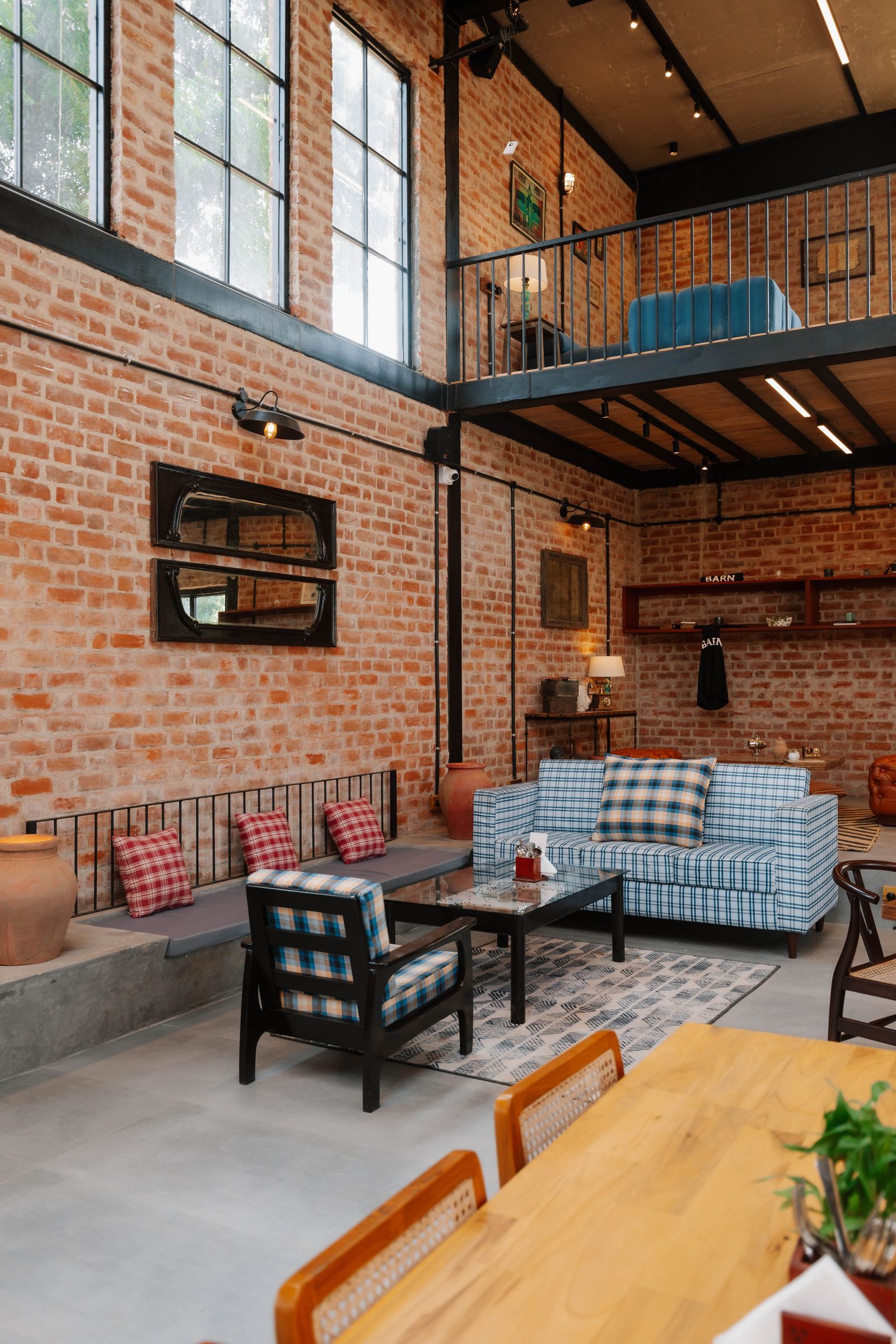 The Barnyard Co. — lounge seating with exposed brick wall